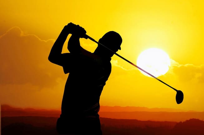 golfer silhouette at sunset